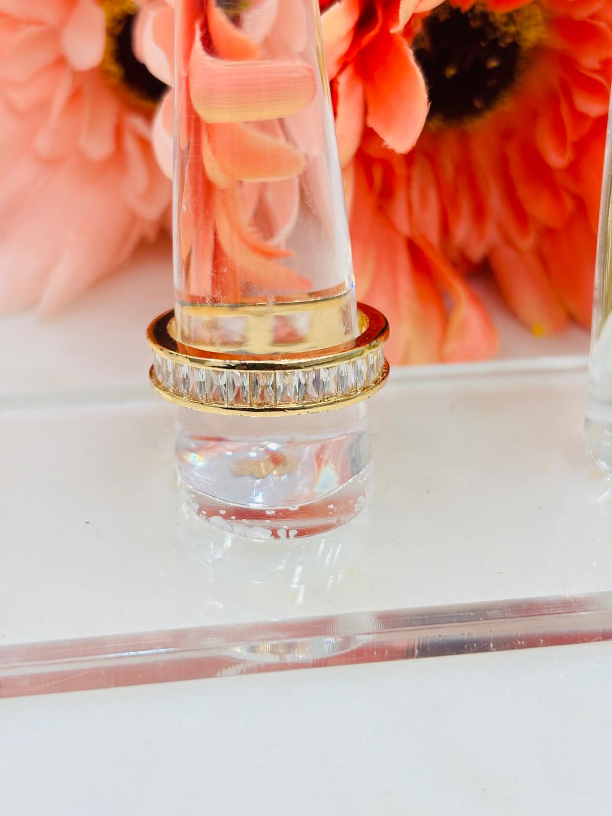 Gold ring with minimal diamonds on it. 